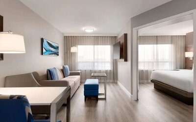 Day use studio suite with living room and work station at the Embassy Suites By Hilton Toronto Airport.