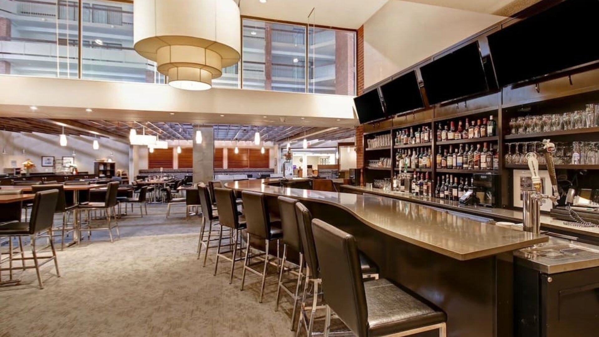 Hotel bar with comfortable seating at the Holiday Inn Oakville Centre.