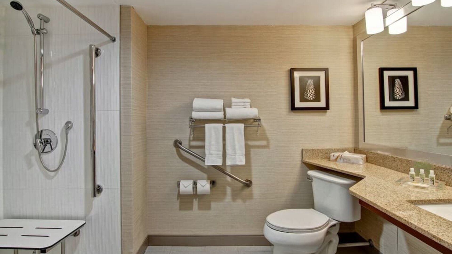 Private guest bathroom with shower and free toiletries at the Holiday Inn Oakville Centre.
