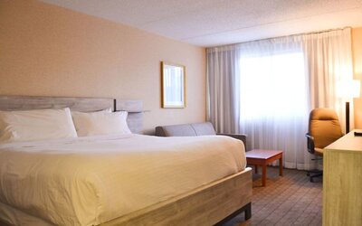 Day use room with sofa, work desk and private bathroom at Amenida Residences.