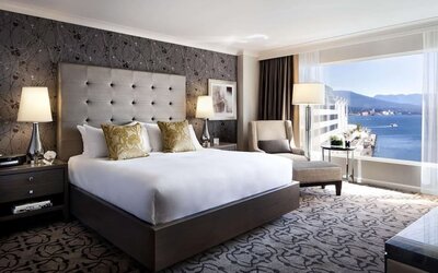 Day use room with TV, work desk, sofa and private bathroom at the Fairmont Waterfront.