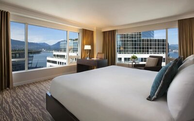 Day use room with work desk, sofa and private bathrom at the Fairmont Waterfront.