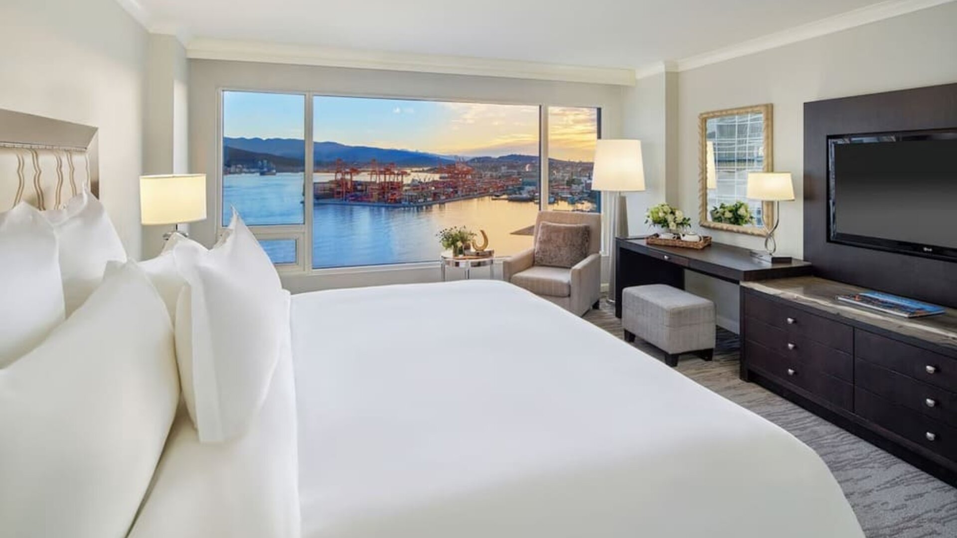 Day use room with TV, work desk, sofa and private bathroom at the Fairmont Waterfront.