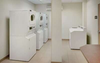 Laundry room at Staybridge Suites Oakville-Burlington.