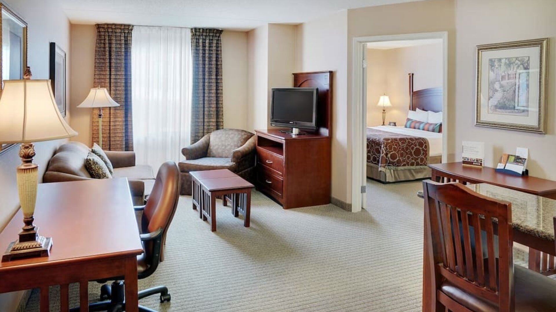 Studio suite with living room, kitchen, work desk and private bathroom at Staybridge Suites Oakville-Burlington.