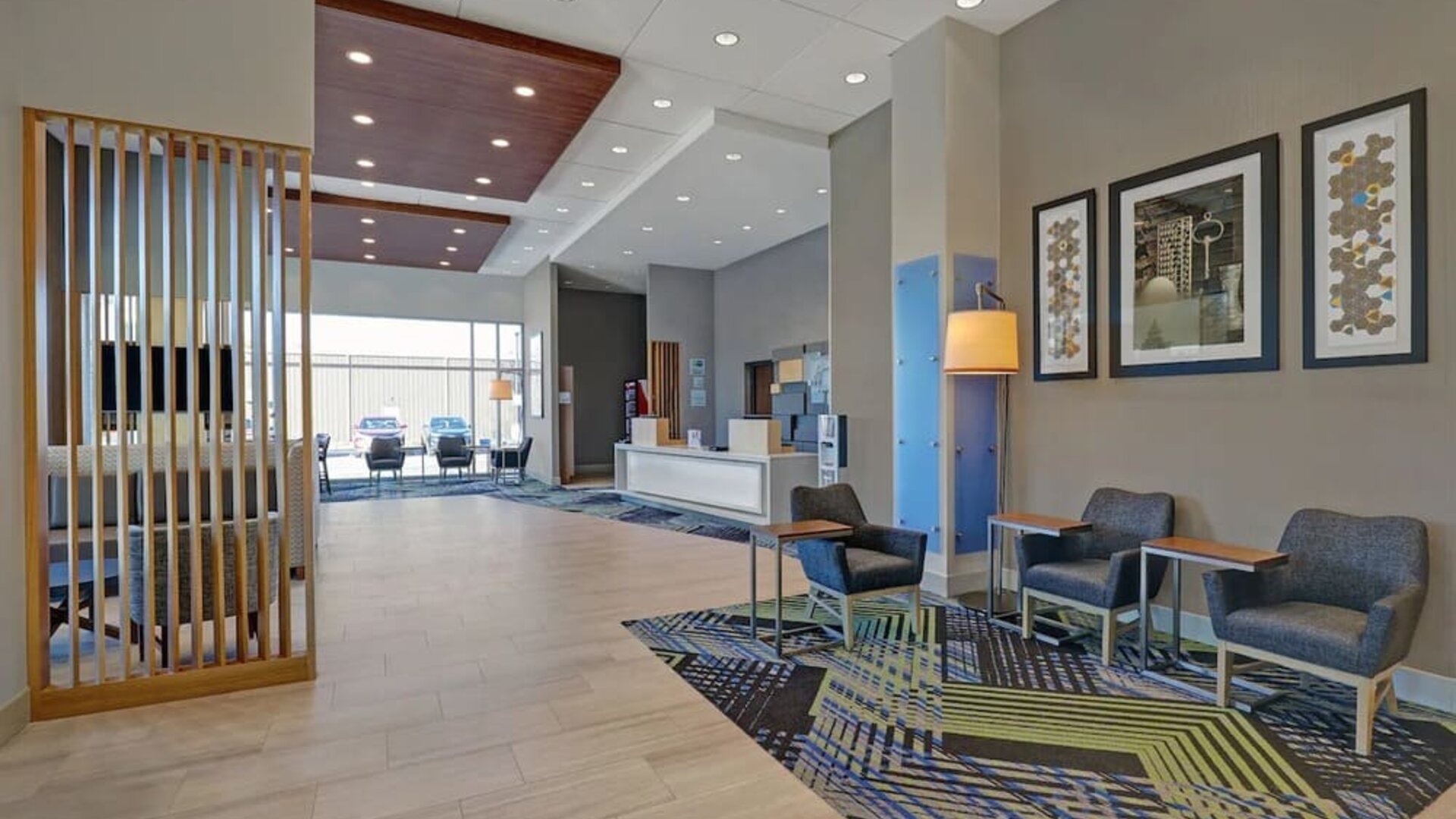 Hotel lobby with lounge area at Holiday Inn Express Kingston West.