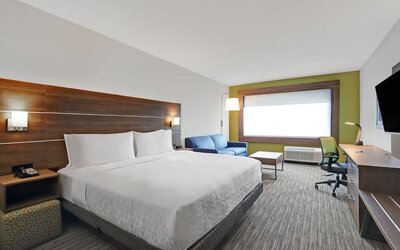 Day use room with TV, sofa, work desk and private bathroom at Holiday Inn Express Kingston West.
