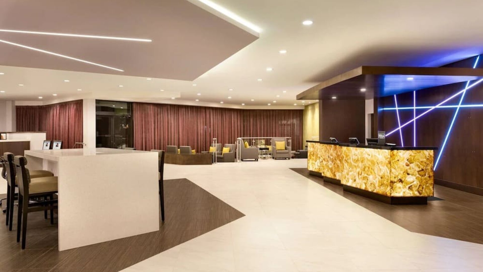 Hotel lobby with lounge area and work space at DoubleTree By Hilton Hotel Toronto Airport West.
