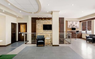 Hotel lobby with lounge area and workspace at La Quinta Inn & Suites By Wyndham Oshawa.