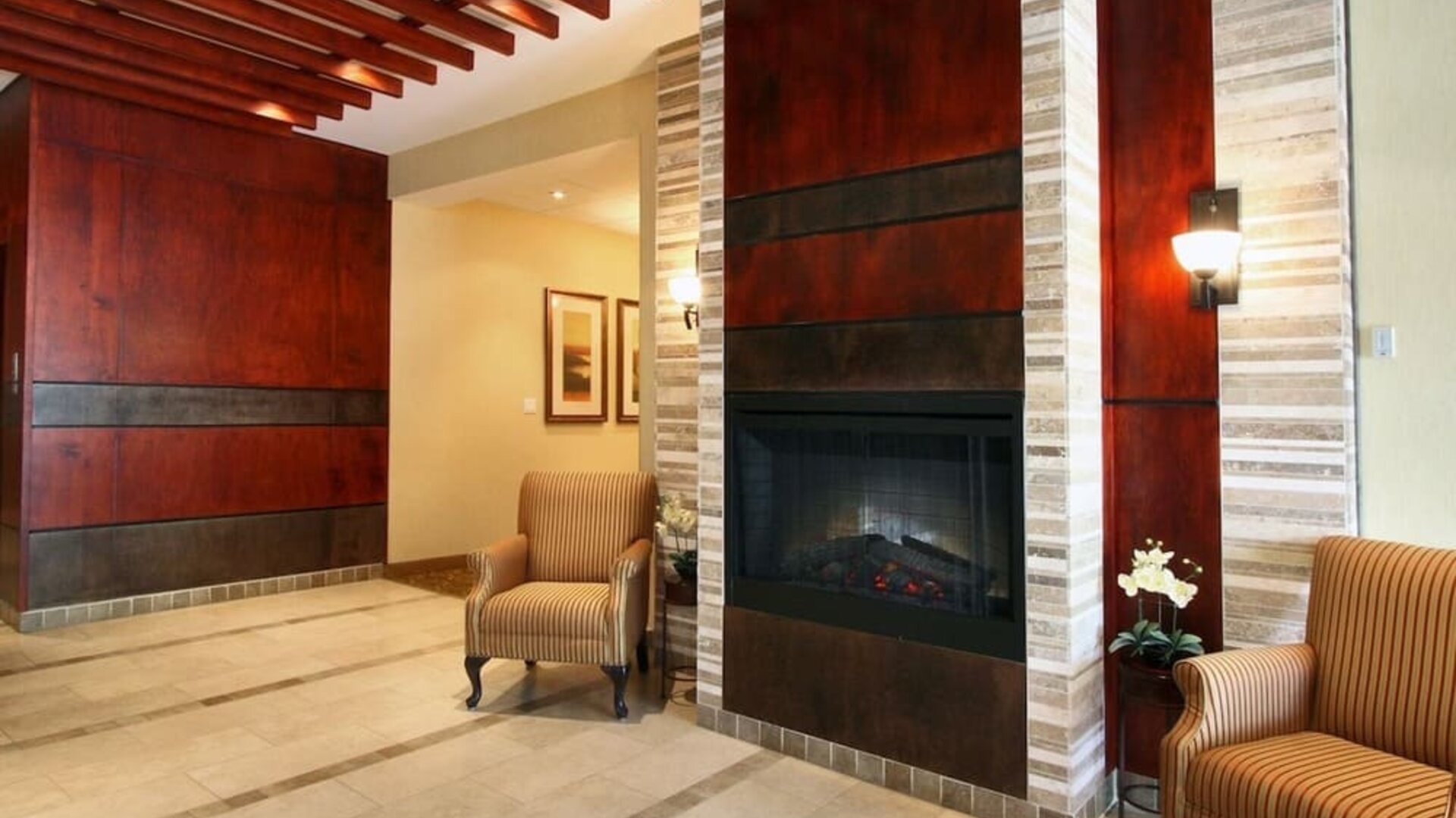 Lobby lounge area with fireplace at Days Inn Edmonton Downtown.