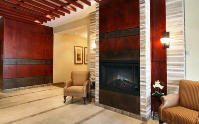 Lobby lounge area with fireplace at Days Inn Edmonton Downtown.