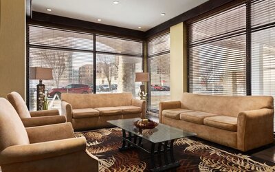 Hotel lobby with comfortable seating at Days Inn Edmonton Downtown.
