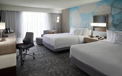 Day use twin room with TV, coffee maker, sofa, work desk and private bathroom at Courtyard By Marriott Toronto Airport.