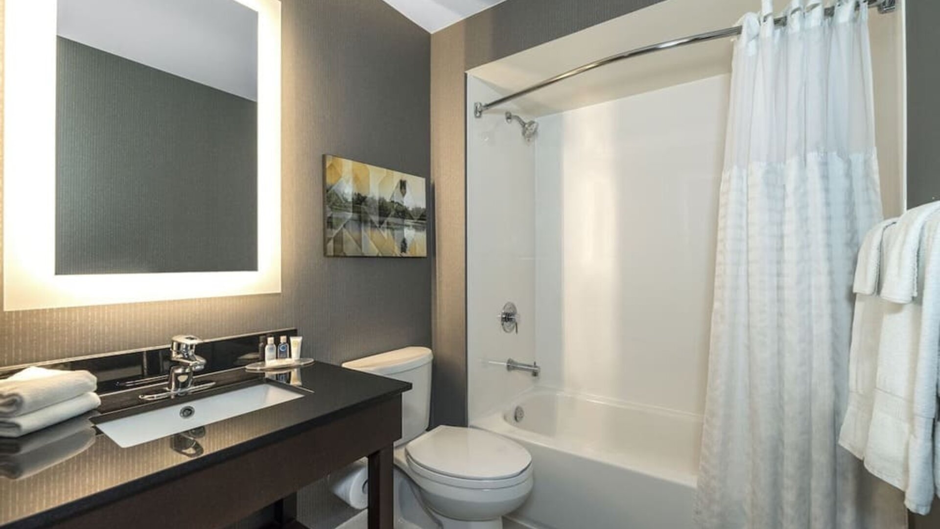 Guest bathroom with tub and free toiletries at Comfort Inn Simcoe.