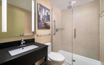 Guest bathroom with shower at Best Western Premier Herald Square.