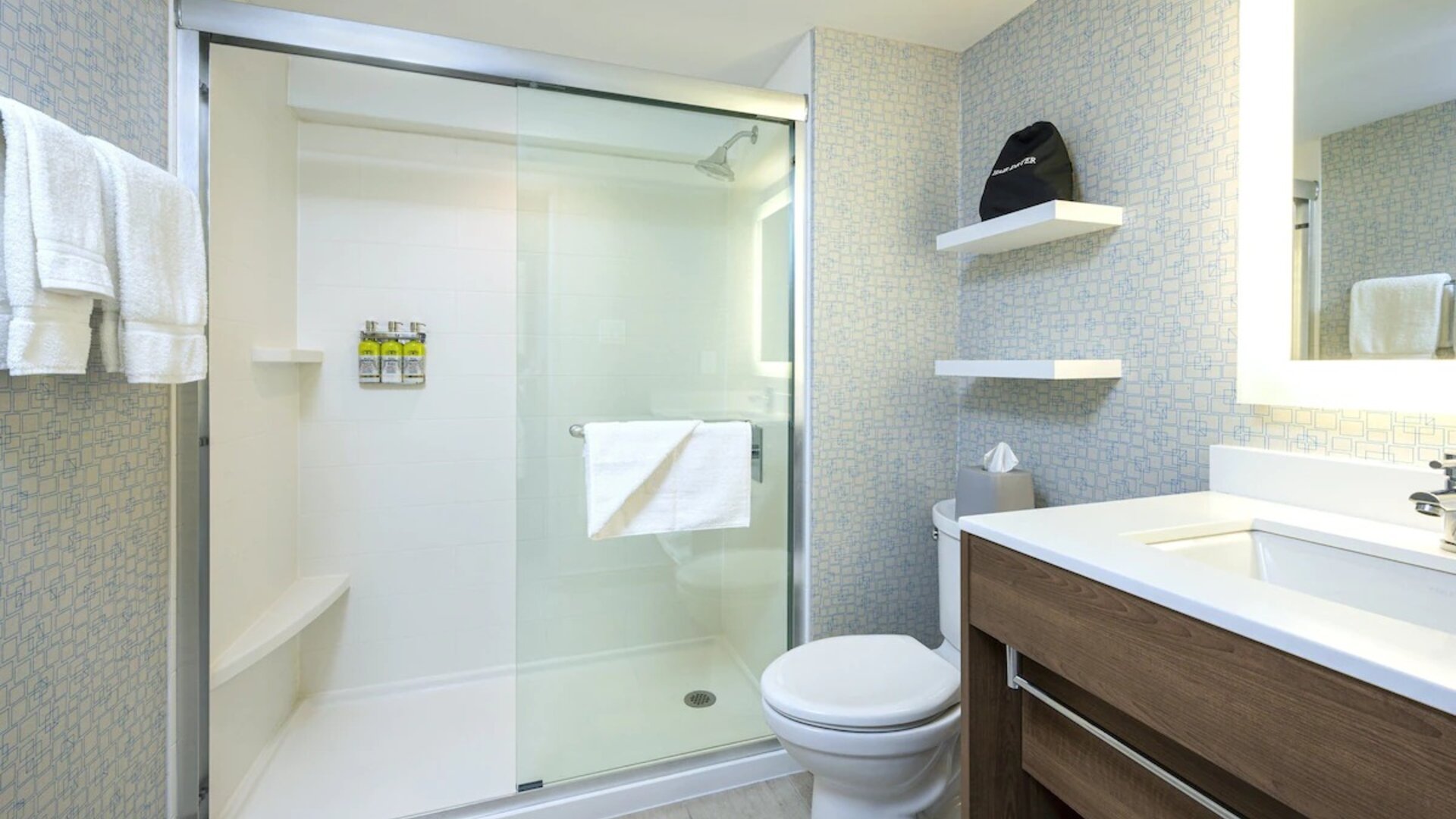 Guest bathroom with shower and free toiletries at Holiday Inn Express Toronto Downtown.
