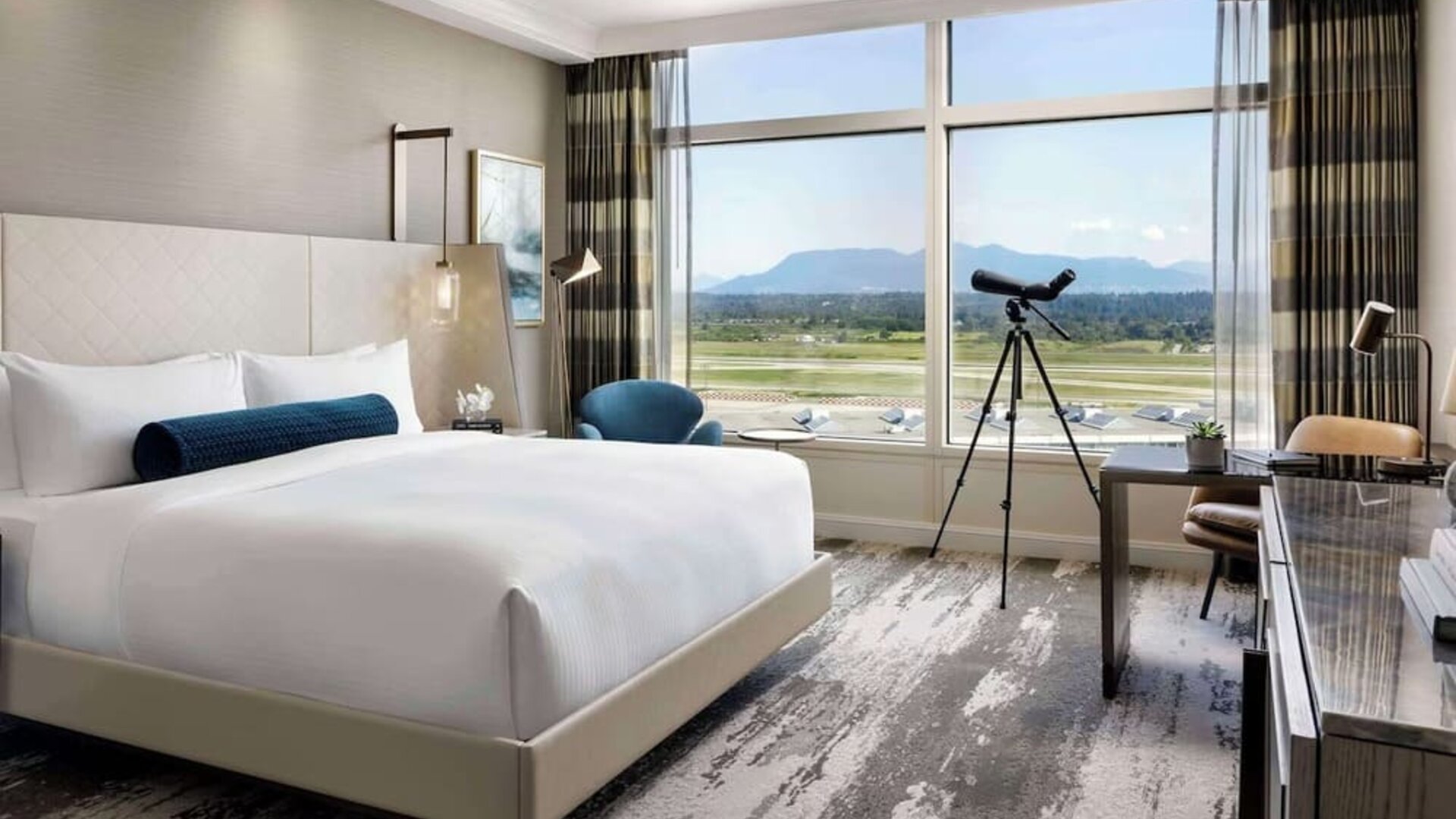 Day use room with large window, sofa, work desk and private bathroom at Fairmont Vancouver Airport - YVR Terminal Hotel.