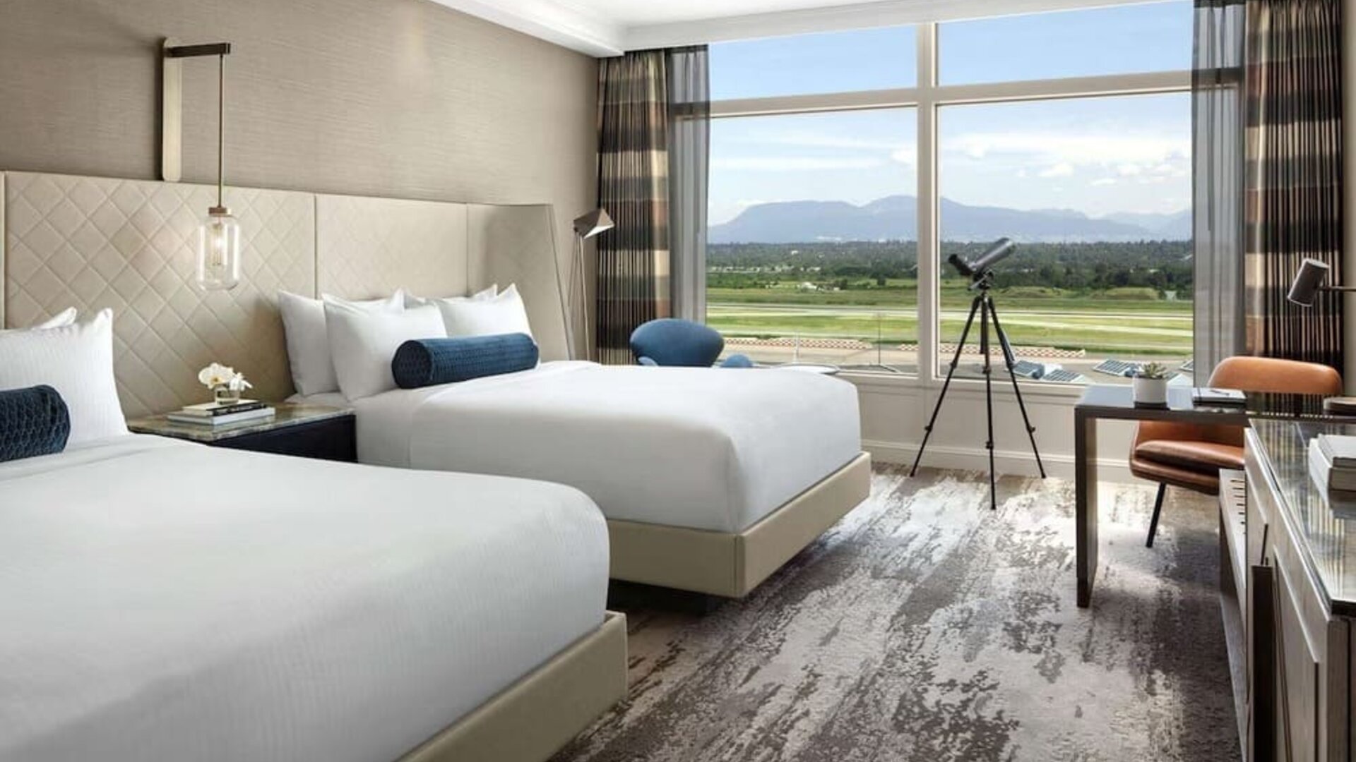 Day use twin room with TV, sofa, work desk and private bathroom at Fairmont Vancouver Airport - YVR Terminal Hotel. 