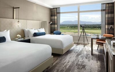 Day use twin room with TV, sofa, work desk and private bathroom at Fairmont Vancouver Airport - YVR Terminal Hotel. 