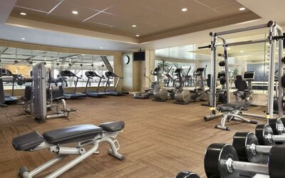 Fully equipped fitness center at Fairmont Vancouver Airport - YVR Terminal Hotel.