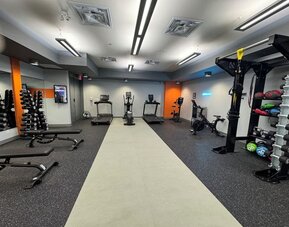 Fully equipped fitness center at Acclaim Hotel Calgary Airport.