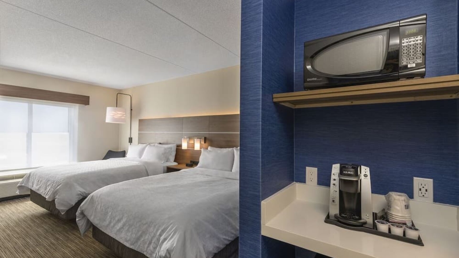 Day use twin room with coffee maker, microwave and mini bar at Holiday Inn Express & Suites North Bay.