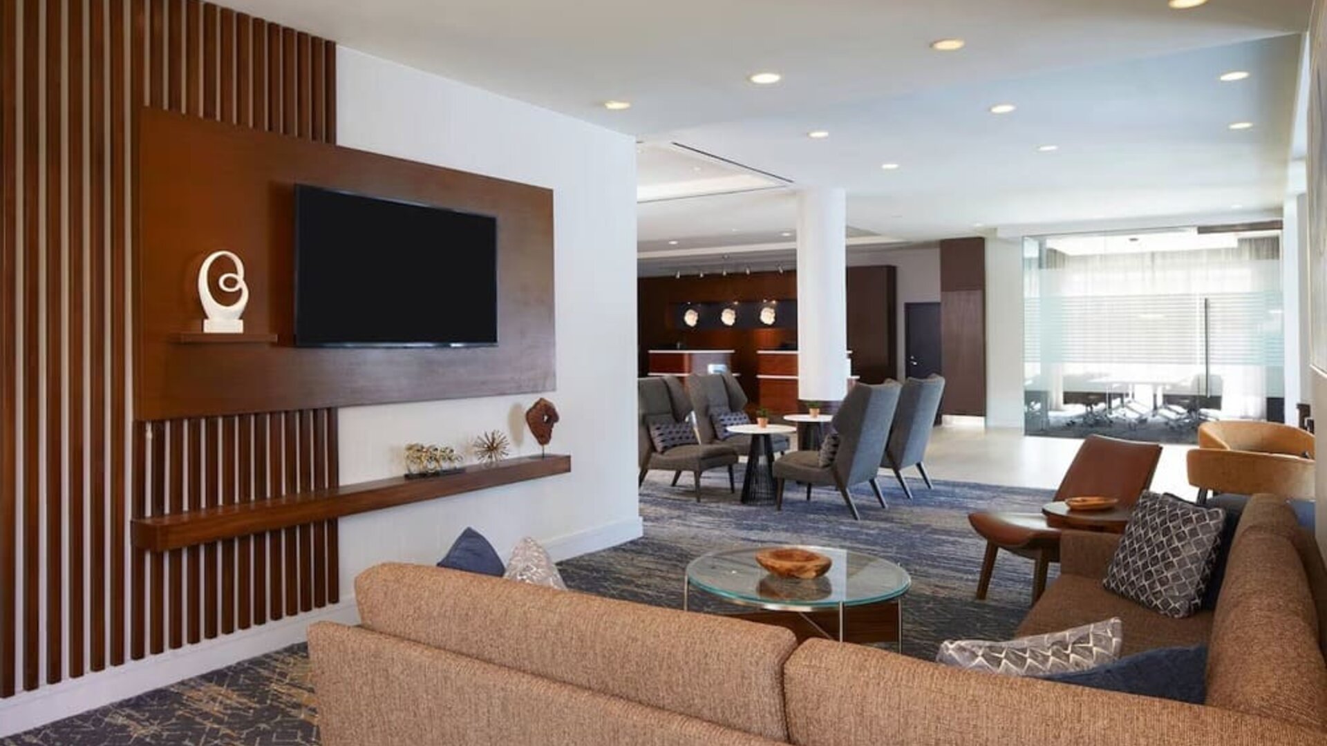 Lobby and coworking lounge at Courtyard By Marriott Los Angeles LAX/Century Boulevard.