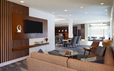 Lobby and coworking lounge at Courtyard By Marriott Los Angeles LAX/Century Boulevard.