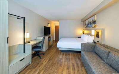 Day use room with TV, sofa, work desk and private bathroom at Comfort Inn Corner Brook.