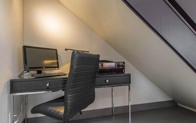 Business center with computer, printer and ergonomic chair at Comfort Inn Val D'or. 