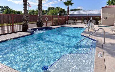 Refreshing outdoor pool at Hampton Inn Deer Park.
