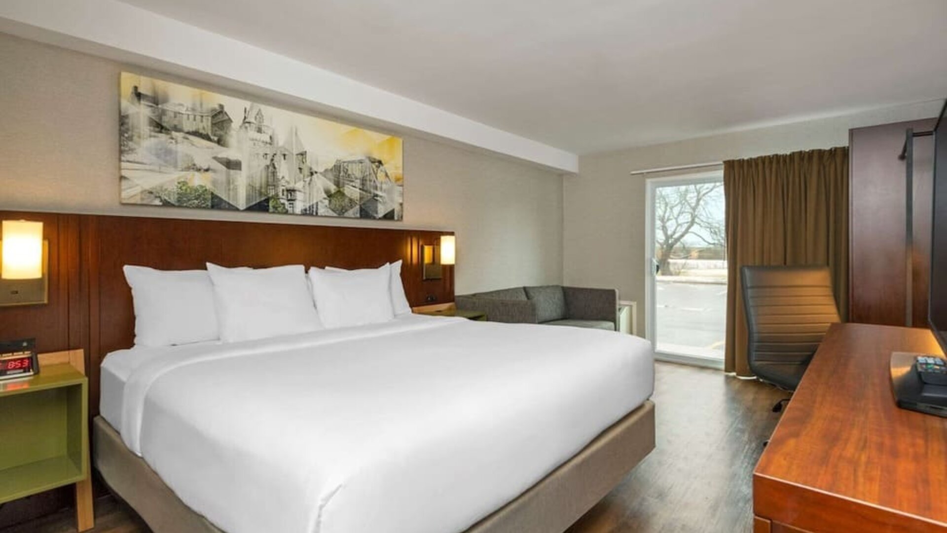 Day use room with TV, sofa, work desk and private bathroom at Comfort Inn Ottawa East.