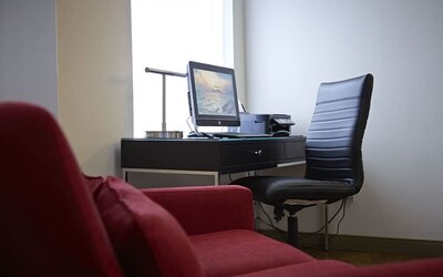 Lobby workspace with computer, printer and ergonomic chair at Comfort Inn Orillia.