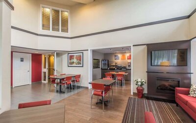 Lobby lounge with fireplace and comfortable sitting at Comfort Inn New Glasgow.