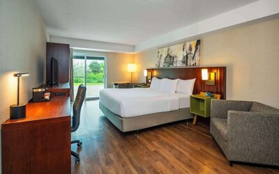 Day use room with TV, sofa, work desk and private bathroom at Comfort Inn Newmarket.