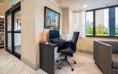 Business center with computer, printer and ergonomic chair at Comfort Inn Newmarket.