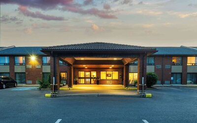 Hotel entrance and parking area at Comfort Inn Kingston HWY 401.