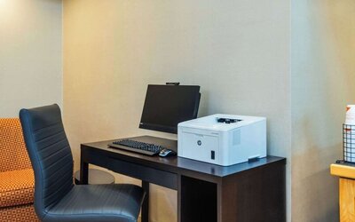 Business center with computer, printer and ergonomic chair at Comfort Inn Kingston HWY 401.