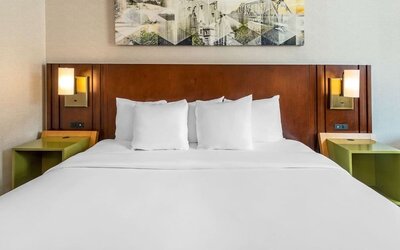 Comfortable king bed at Comfort Inn Ottawa West.