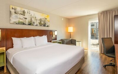 Bright and spacious day use room with sofa, work desk and private bathroom at Comfort Inn Ottawa West.