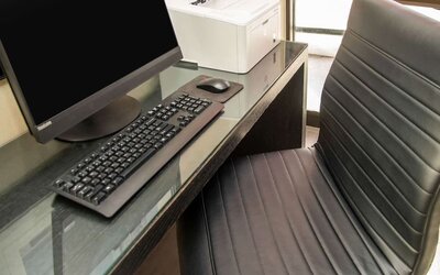 Business center with computer, printer and ergonomic chair at Comfort Inn Ottawa West.