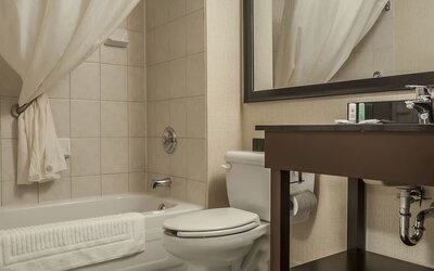 Guest bathroom with tub and free toiletries at Comfort Inn Edmundston.