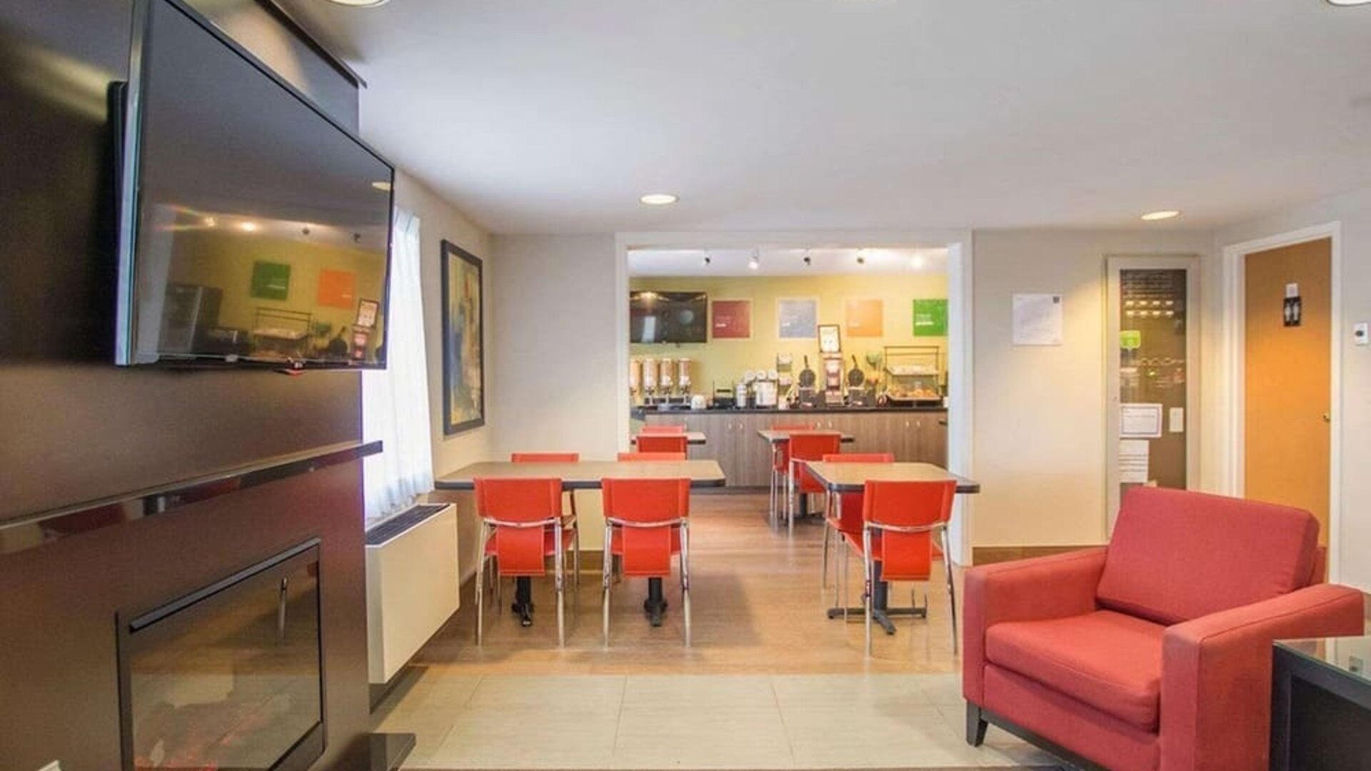 Lobby lounge with fireplace at Comfort Inn Amherst.