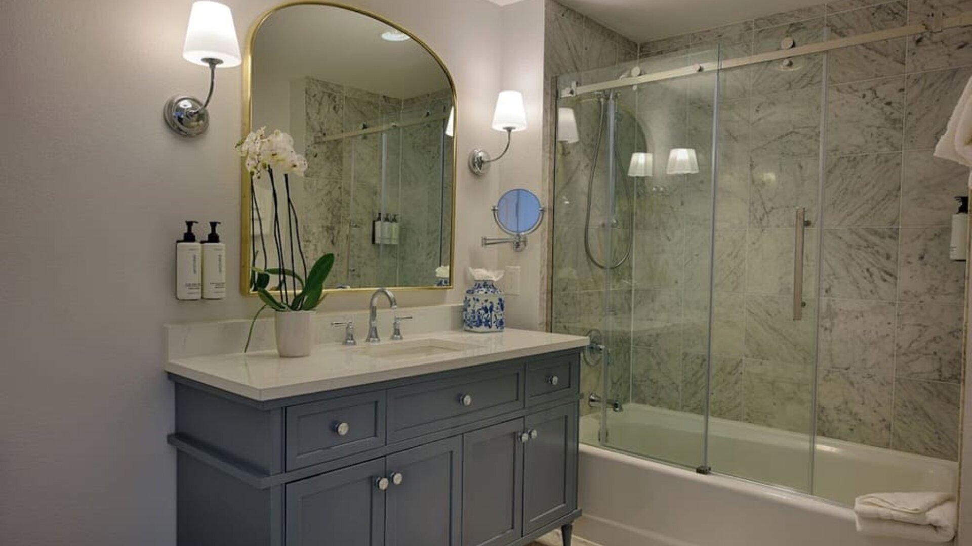 Guest bathroom with shower and tub at St James Hotel, An Ascend Hotel Collection Member.