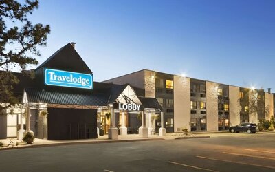 Hotel exterior and parking area at Travelodge Edmonton South.