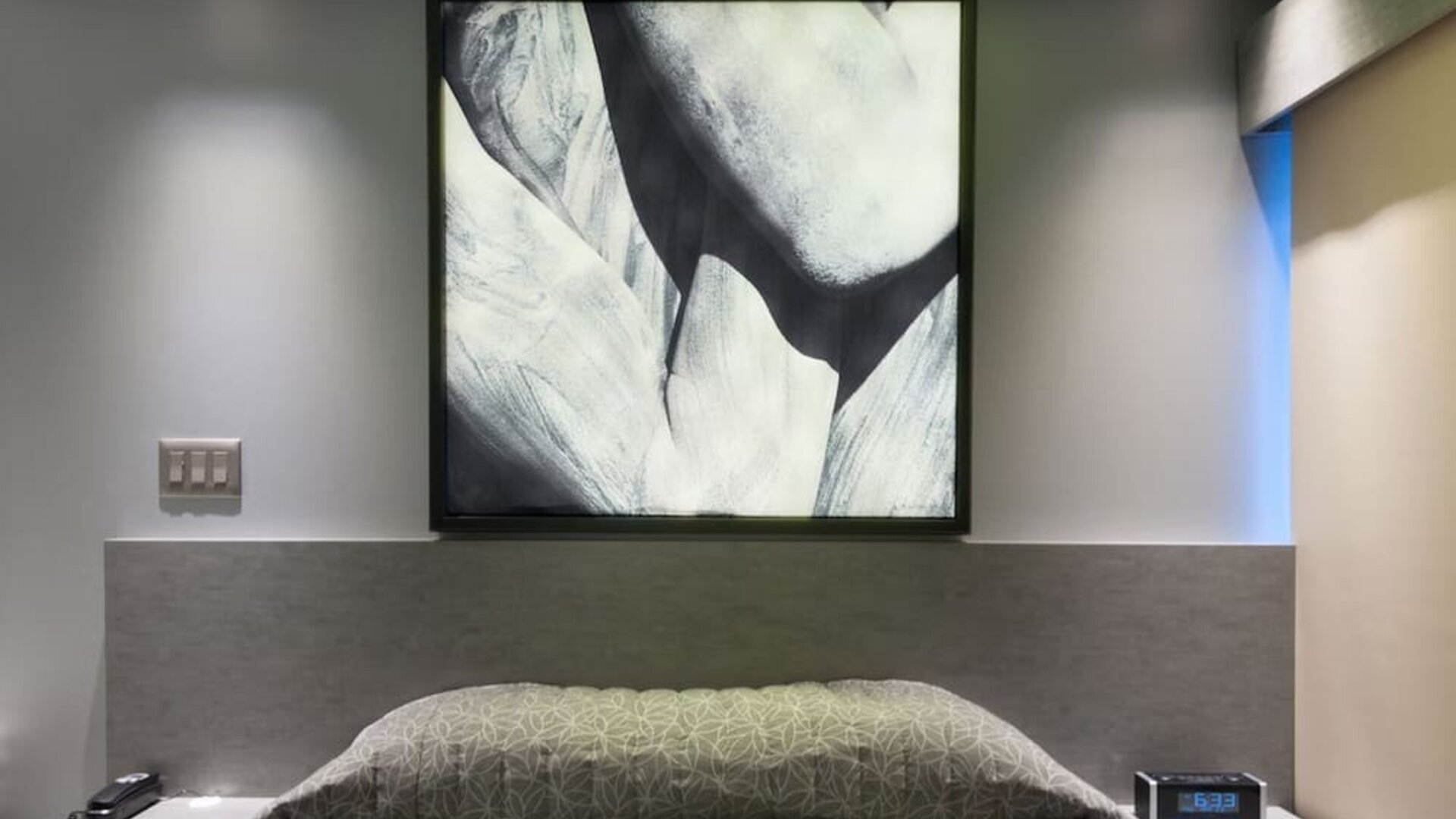 King bed at Le Chabrol Hotel Et Suites.