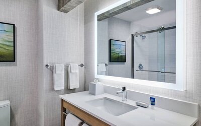 Guest bathroom with shower at Four Points By Sheraton Salt Lake City Airport.