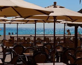 Dining area with ocean view at Riptide Hotel.