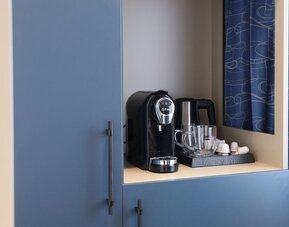 Day room with coffee station at Spark By Hilton Luton.