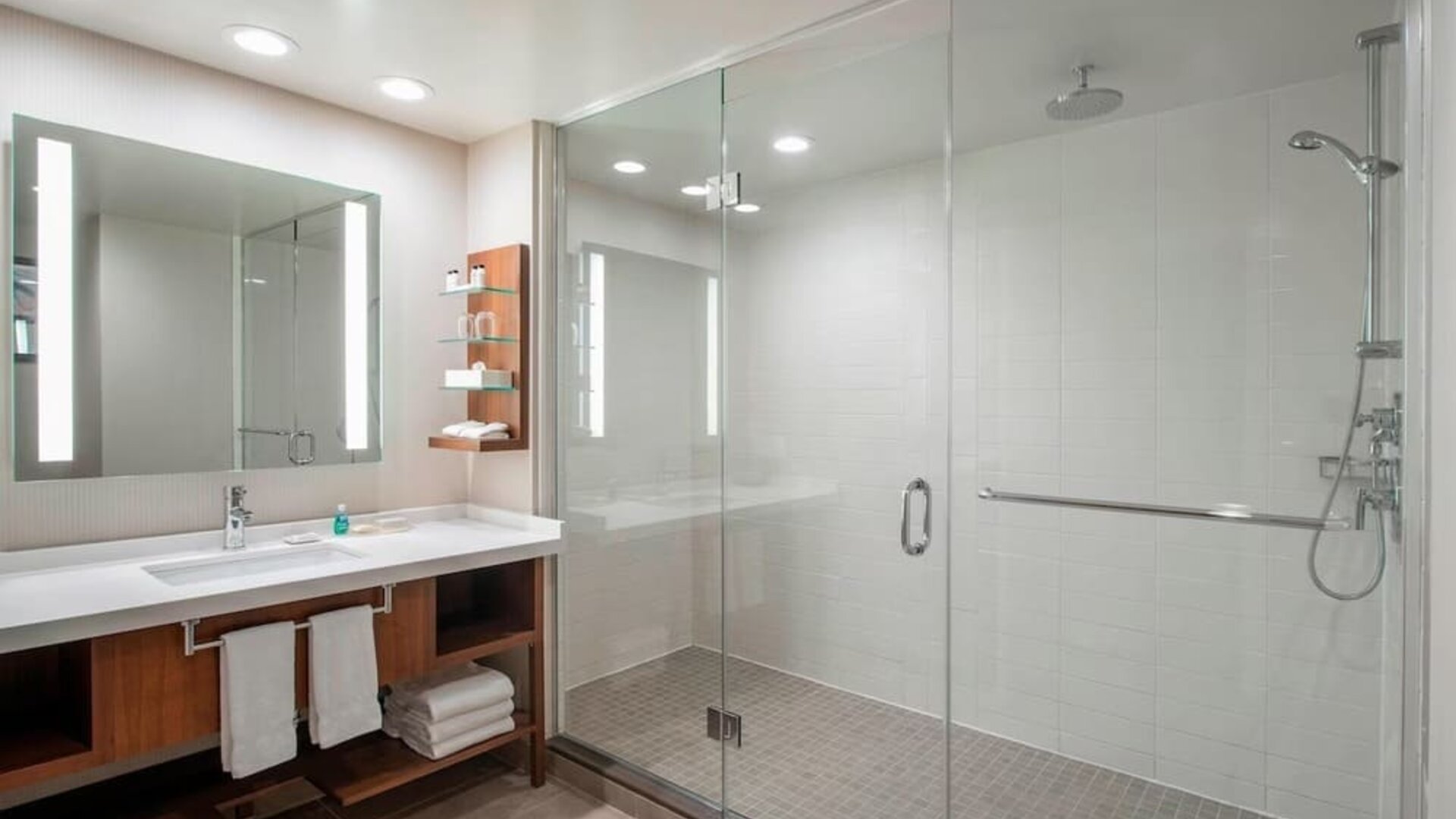 Guest bathroom with shower and free toiletries at Delta Hotel By Marriott Regina.